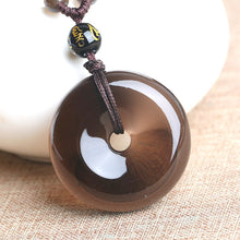 Load image into Gallery viewer, Handcrafted Natural Translucent Black Obsidian Donut Pendant Necklace
