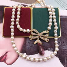 Load image into Gallery viewer, Handmade Double Strands Natural Pearl Beaded Bow Knot Pendant Necklace
